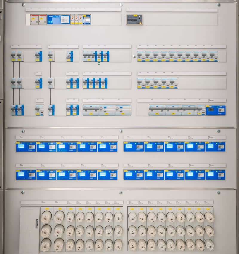 A row of distribution boards in a plant room